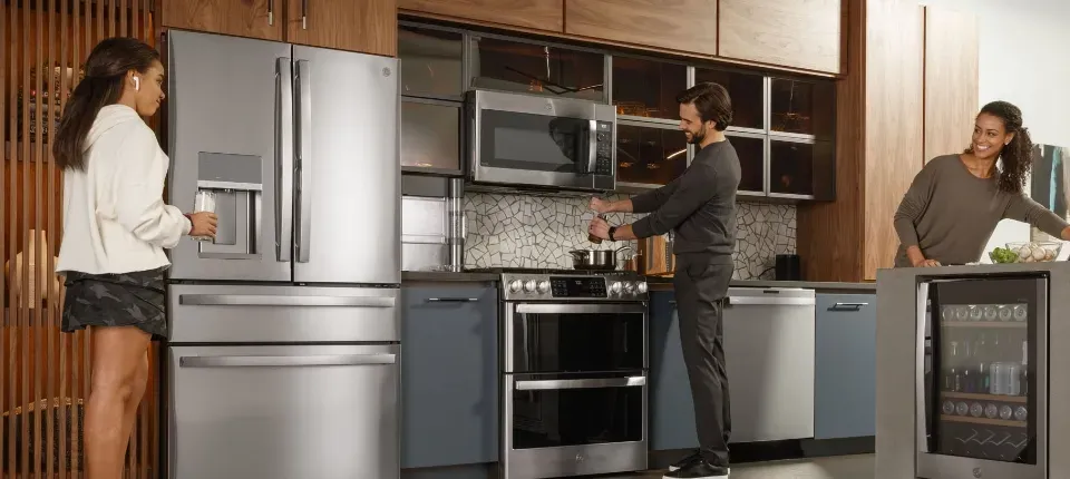 stainless steel refrigerator in modern wooden kitchen